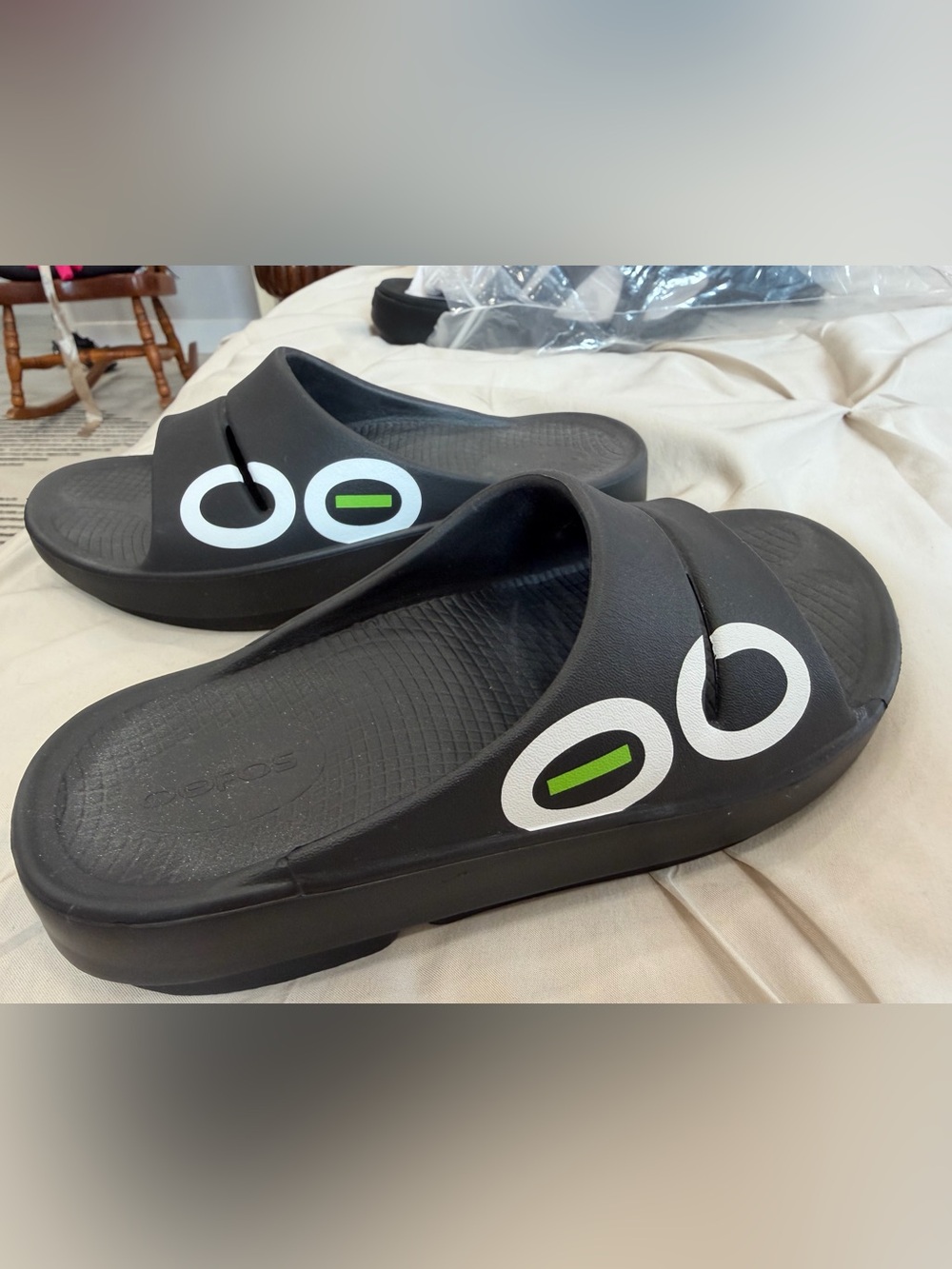 OOFOS unisex Black Slide Sandals with White & Green Logo